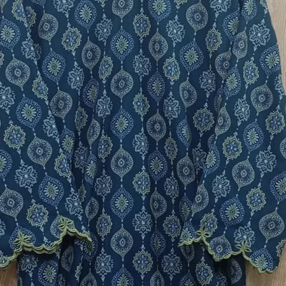 Close-up of an indigo ajrak-inspired print with a scalloped hem